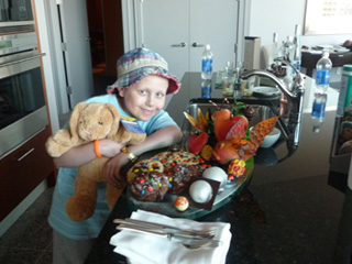 Shaymus posing with a treat tray